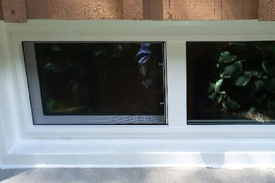 Slider vinyl basement window with custom alumium capping