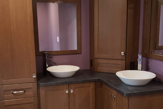 oak bathroom vanity with custom stain and double vessel sinks