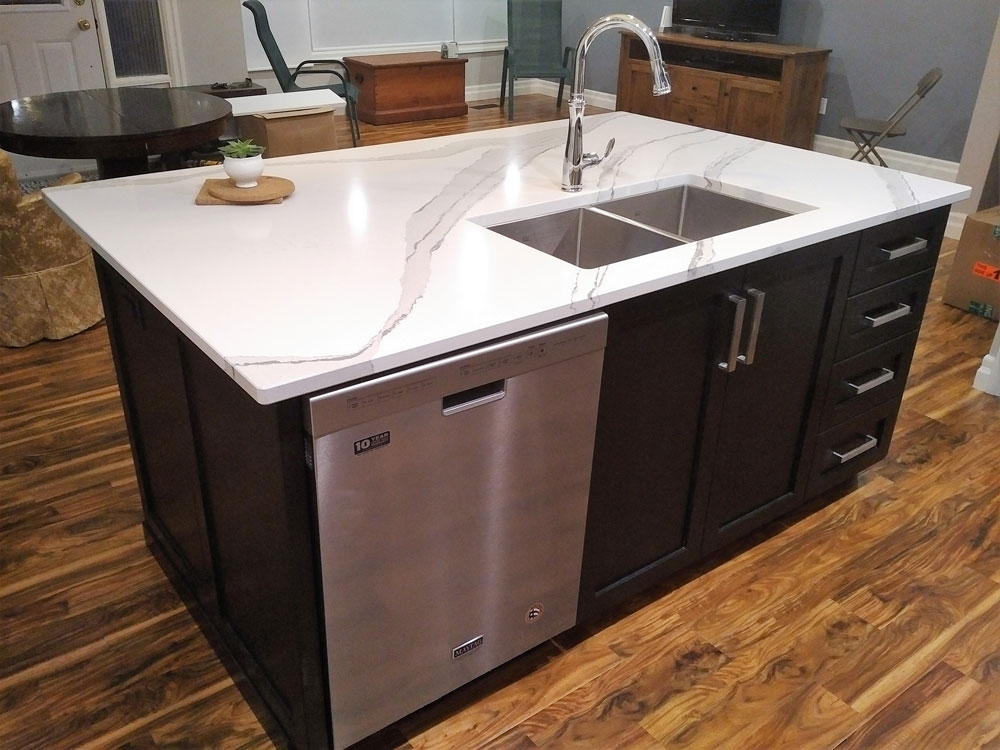 bracket base kitchen island with false door design with quartz counter top and under-mounted sink  
